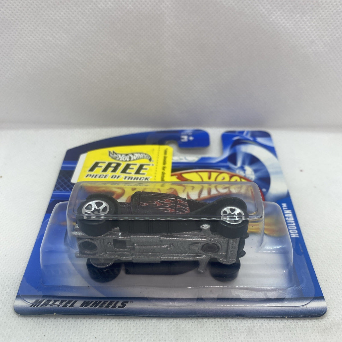 Hot Wheels Hooligan 2001 #203 die-cast car in blue blister, side view