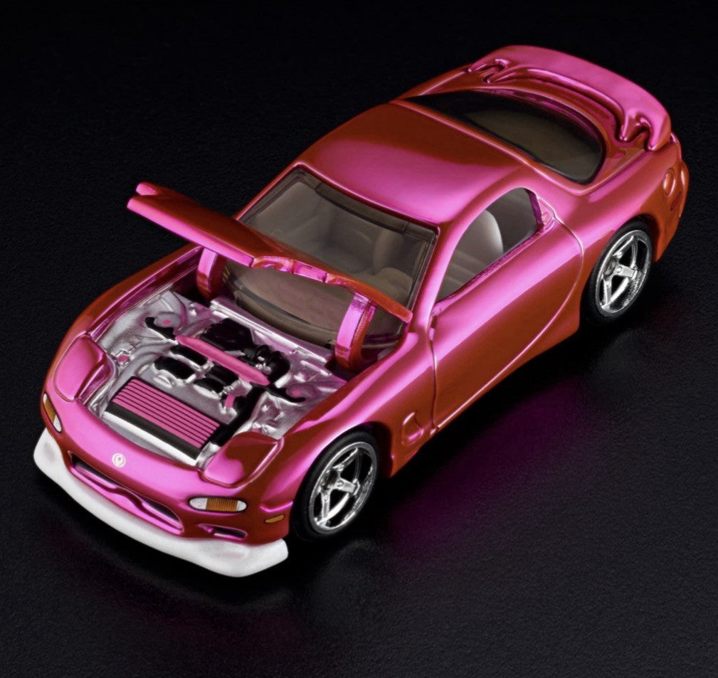 Pink die-cast sports car with open hood, chrome engine detail