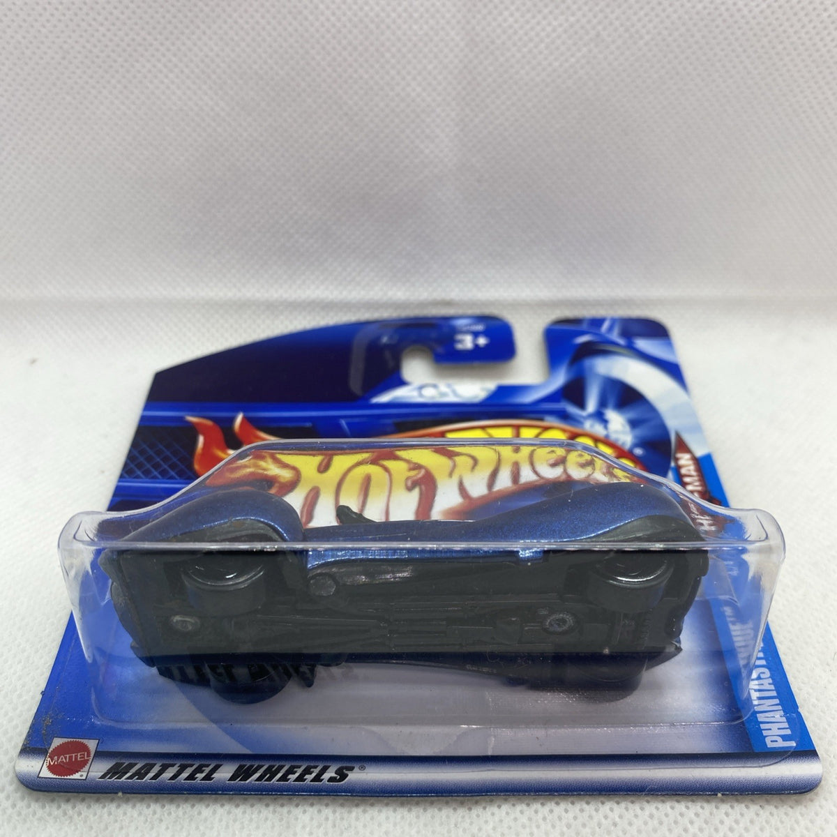 Hot Wheels die-cast car on card, black car body with blue blister backing