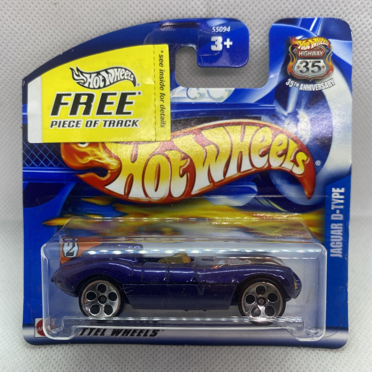 Dark blue Jaguar D-Type die-cast car in blister pack, #209 short card promo