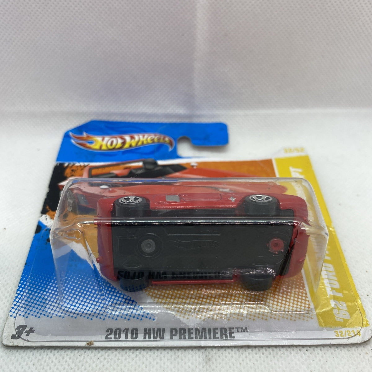 Red Mustang die-cast car rear view in clear blister, 2010 HW Premiere