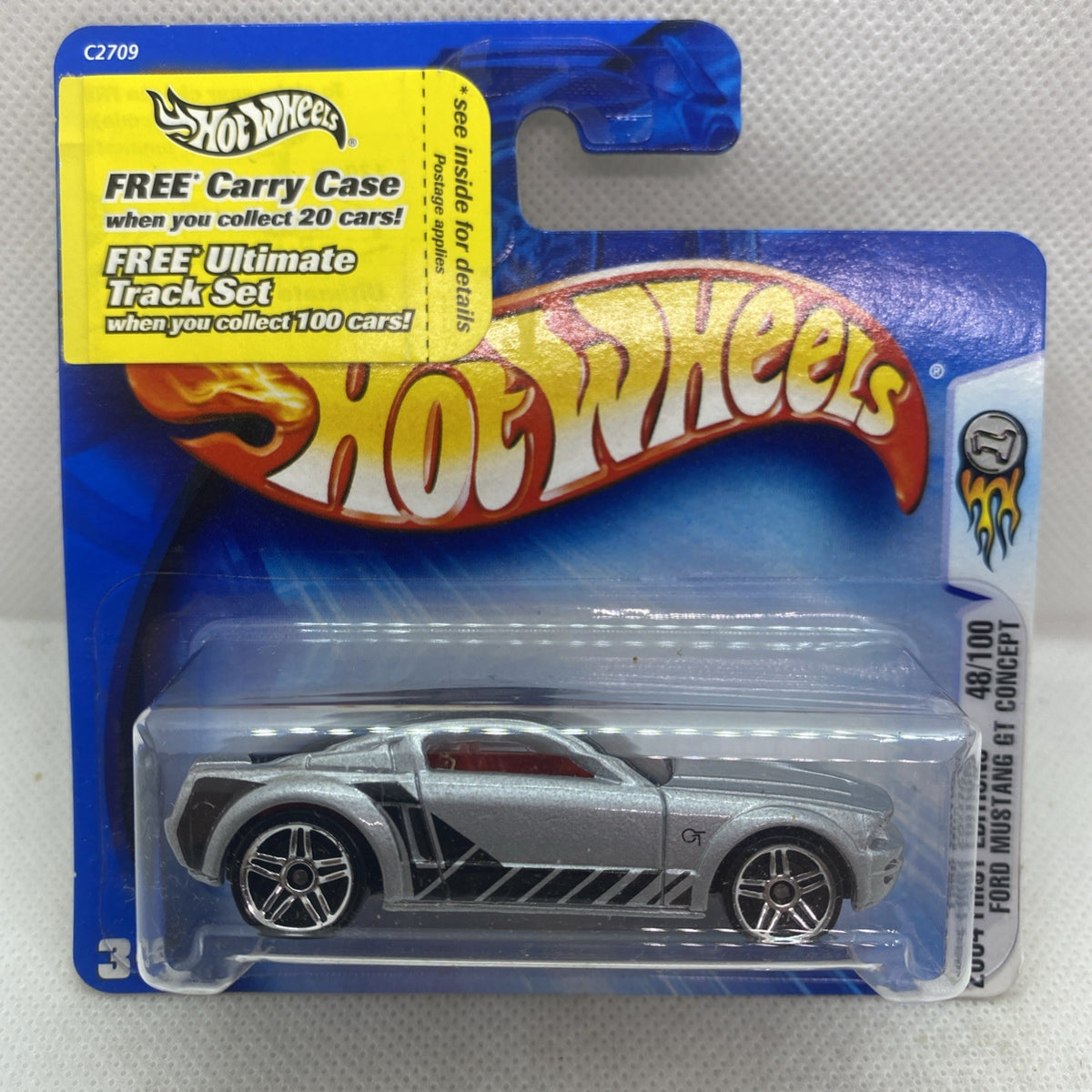 Hot Wheels die-cast car in clear blister, silver/gray with black stripes and chrome wheels