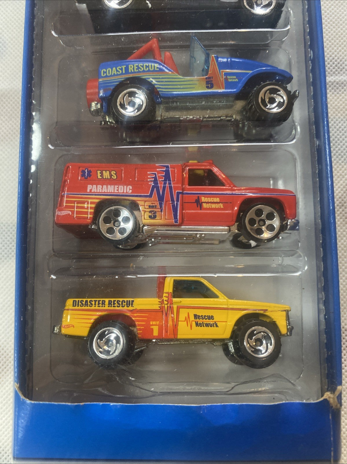 Diecast rescue vehicles in blue box: Coast Rescue, EMS Paramedic, Disaster Rescue