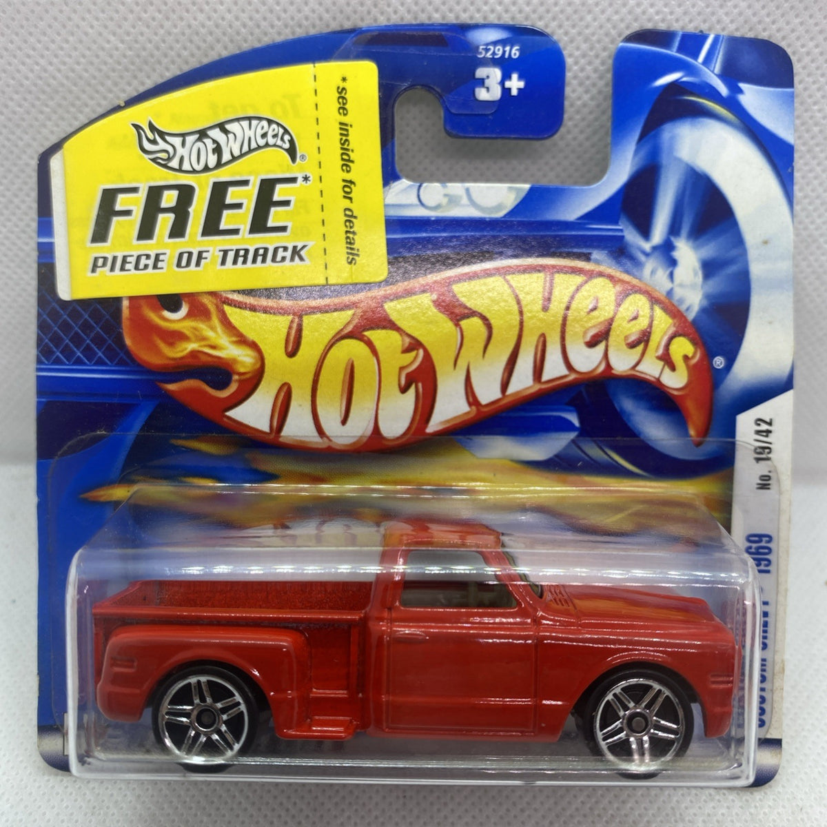 Red Hot Wheels die-cast car in blue blister pack with chrome wheels visible