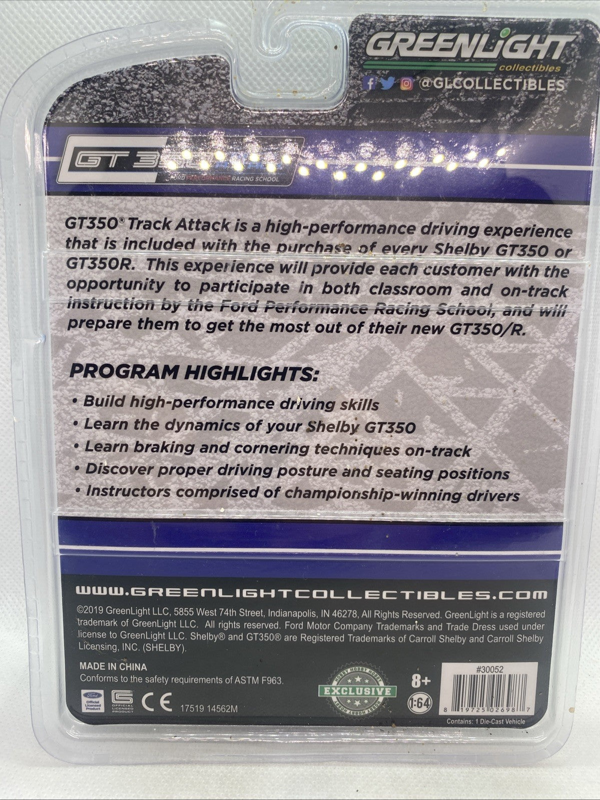 Back of sealed die-cast package with driving program text and barcode labels