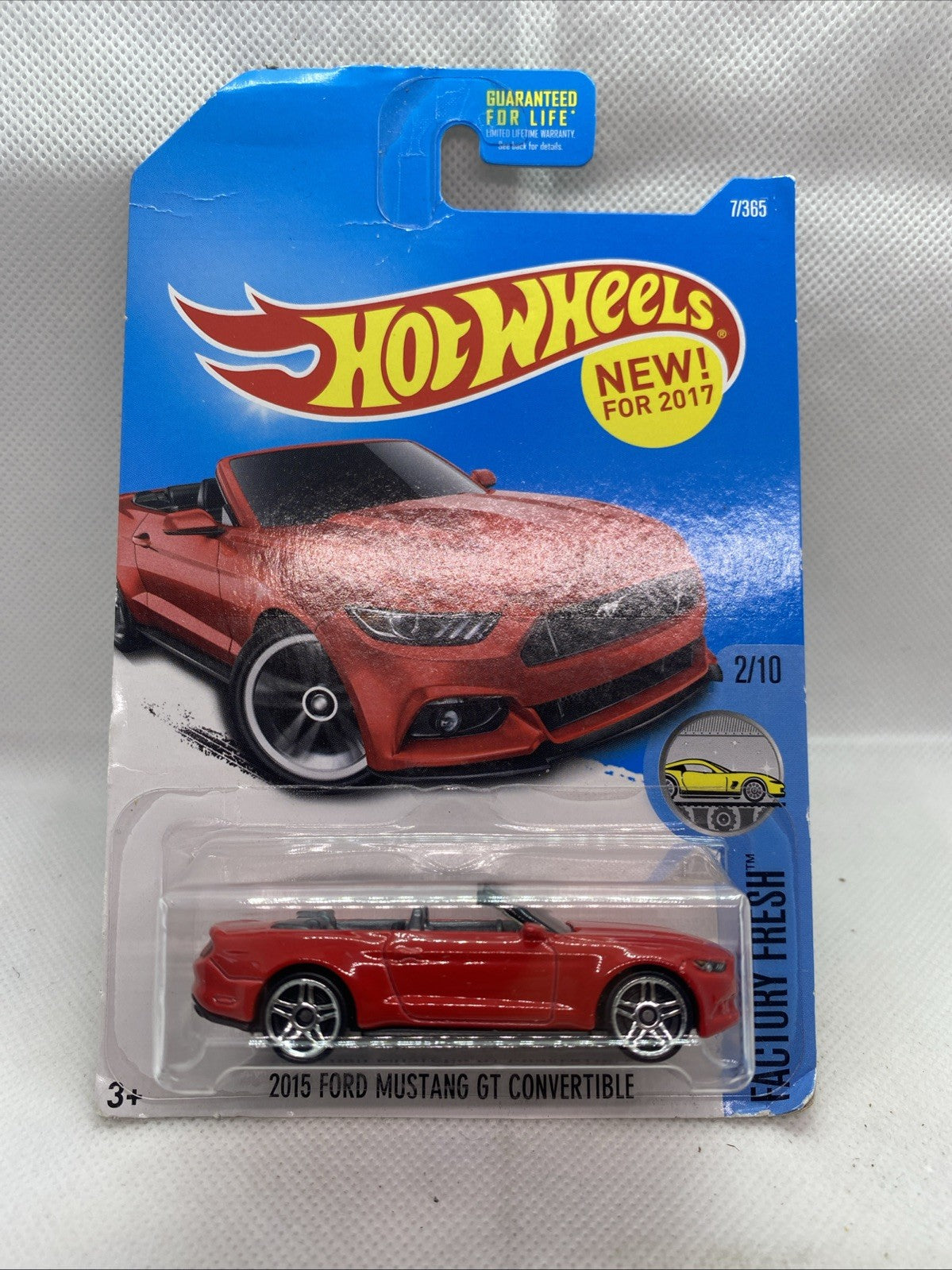 Hot Wheels red Mustang GT convertible toy in blue blister short card