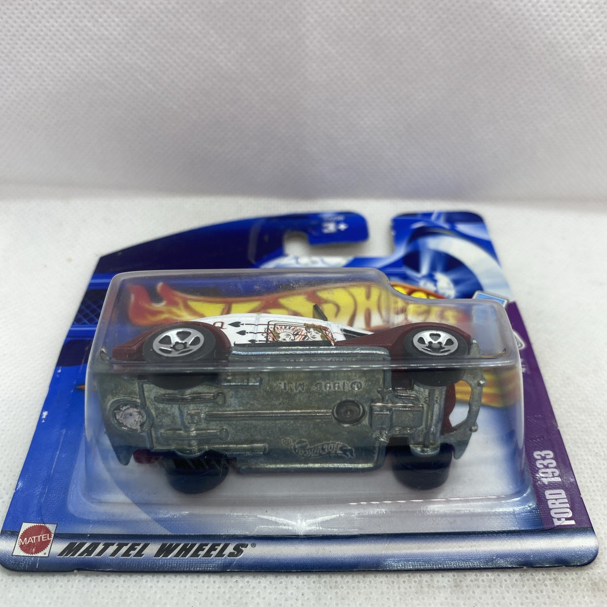 Hot Wheels die-cast Ford 1933 car in sealed blister, dark maroon body with silver trim