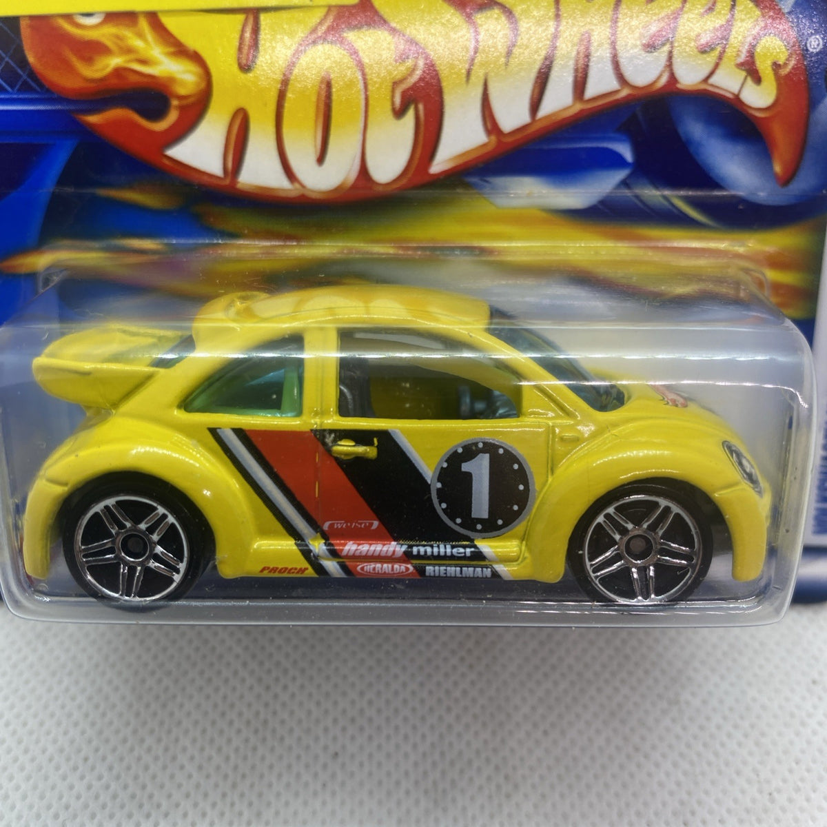 Yellow New Beetle die-cast close-up in clear blister, black wheels