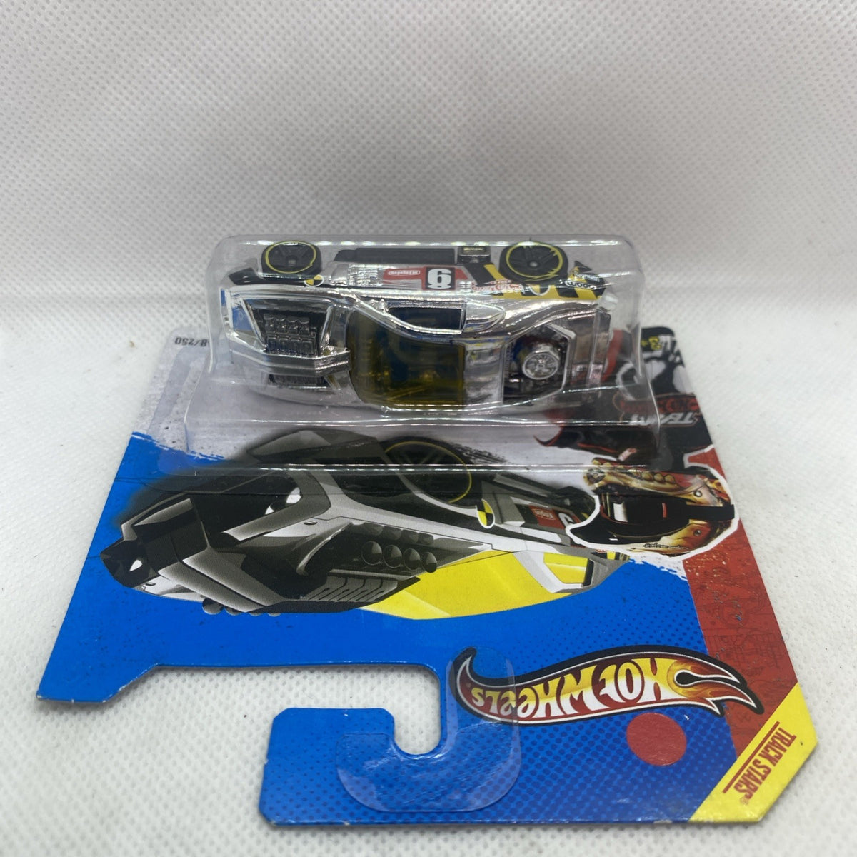 Hot Wheels diecast race car in clear blister on blue and red card backing