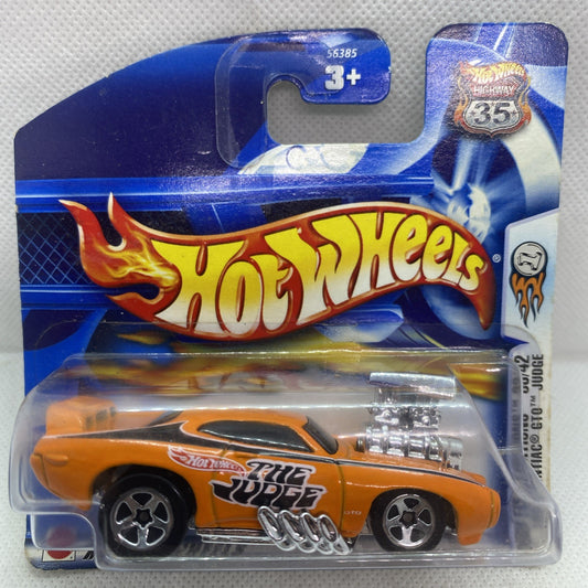 Orange die-cast muscle car toy in blue Hot Wheels blister pack, #045 card front