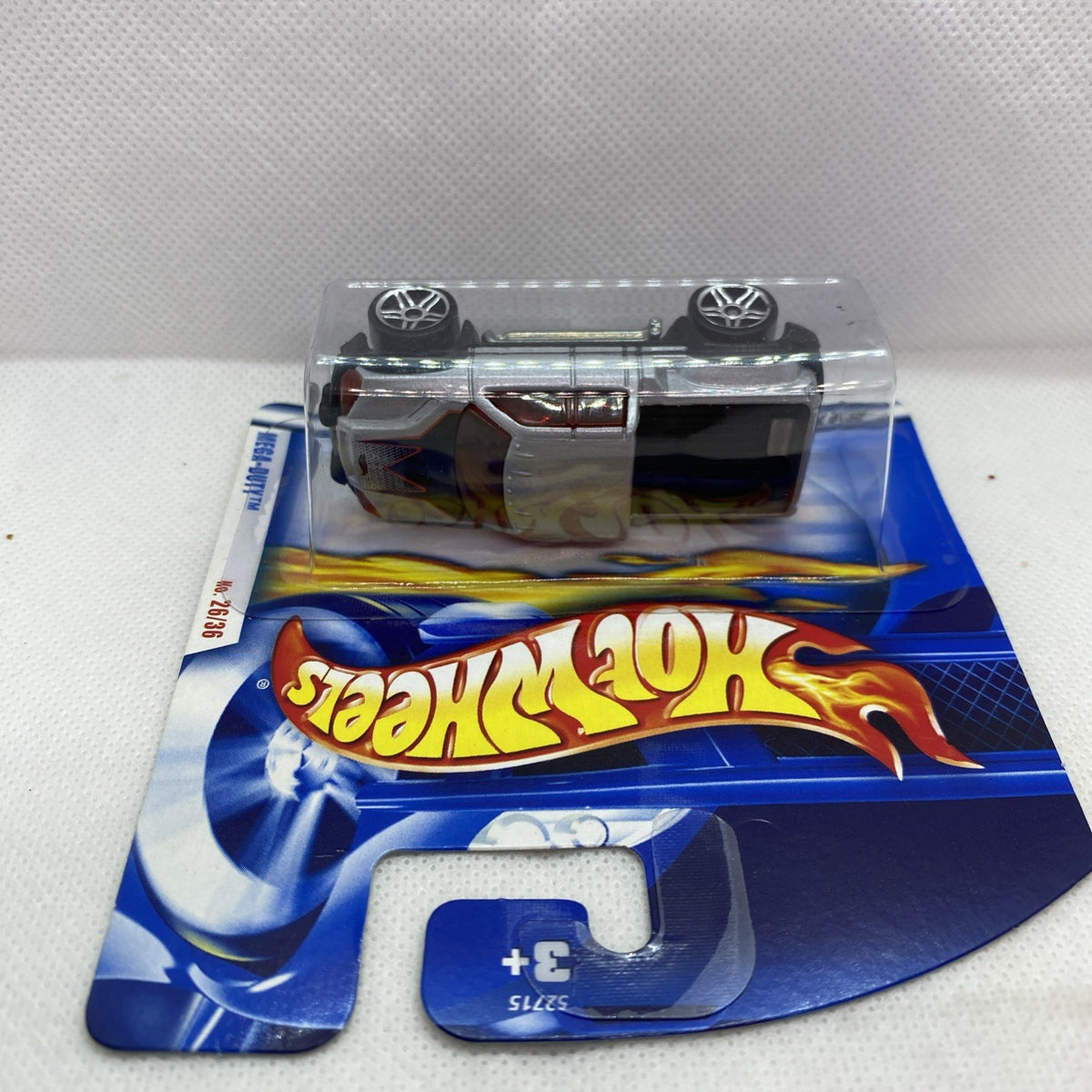 Silver die-cast pickup truck shown from above in clear blister on blue card