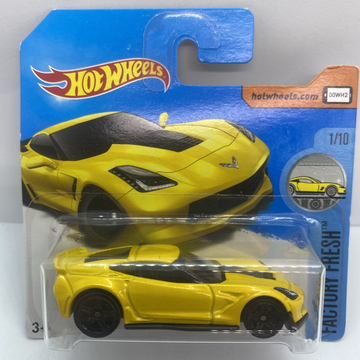 Hot Wheels diecast Corvette C7 Z06 toy car in yellow blister pack with black stripes