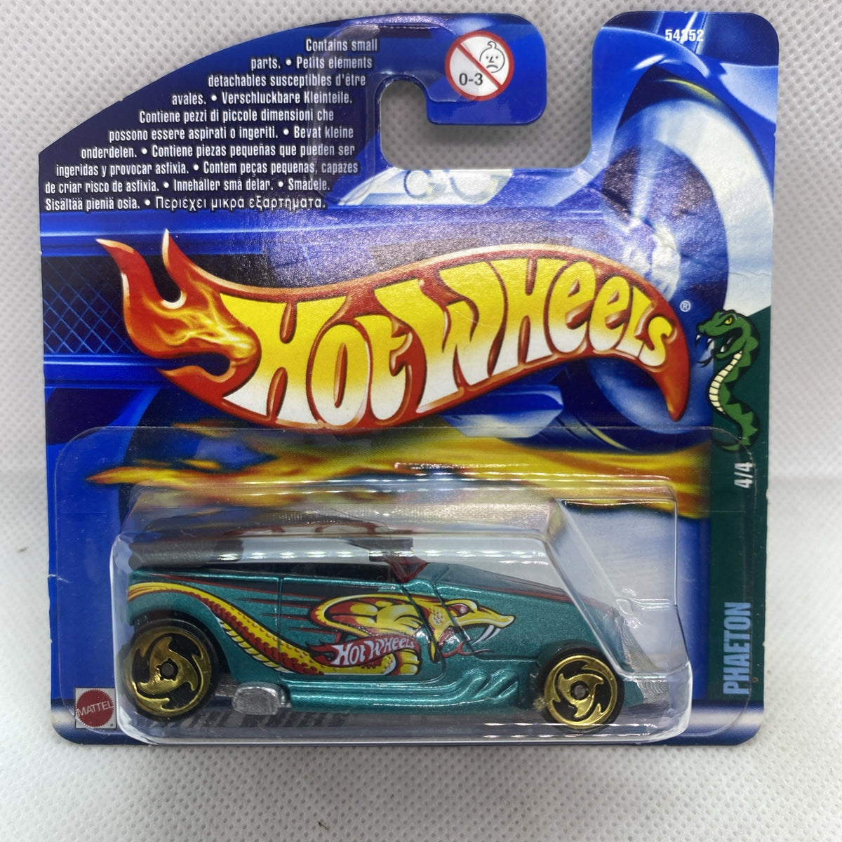 Hot Wheels car on Hot Wheels logo card, teal truck with gold flames in blister