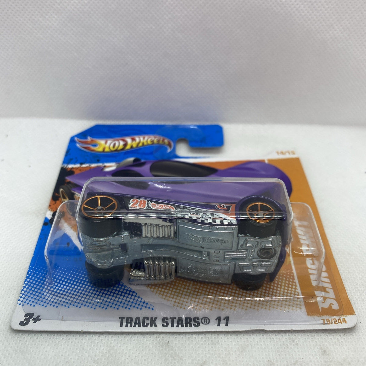 Hot Wheels die-cast car in blister pack, purple body, Track Stars 11, number 28