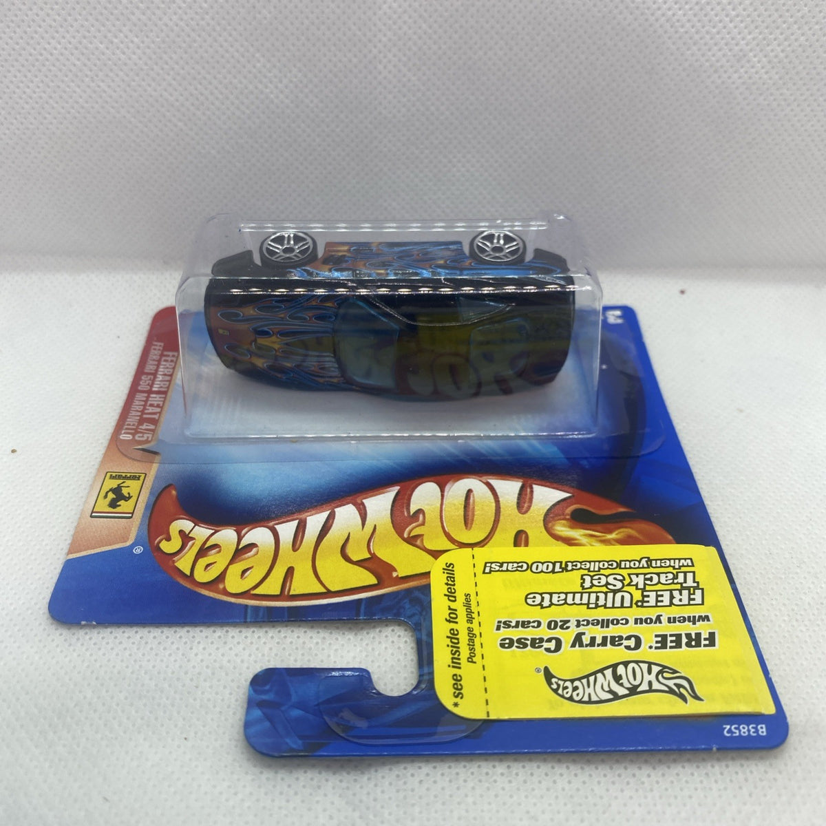 Hot Wheels die-cast Ferrari 550 Maranello side view in blister, black with blue flames