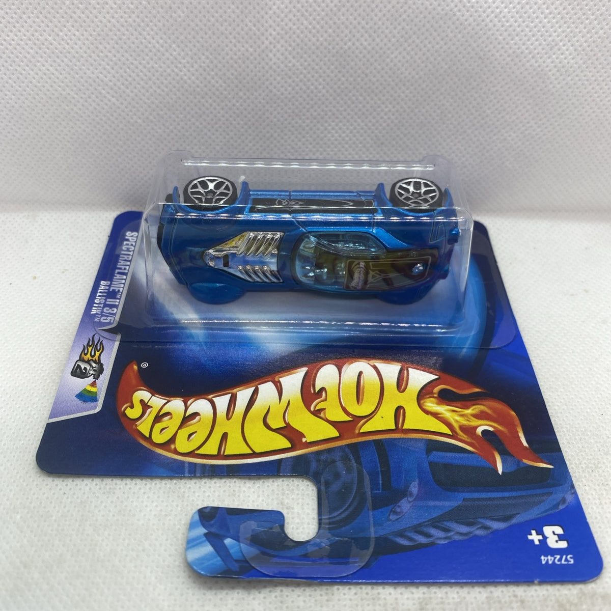 Hot Wheels Spectraflame II blue die-cast car in blister pack, top view