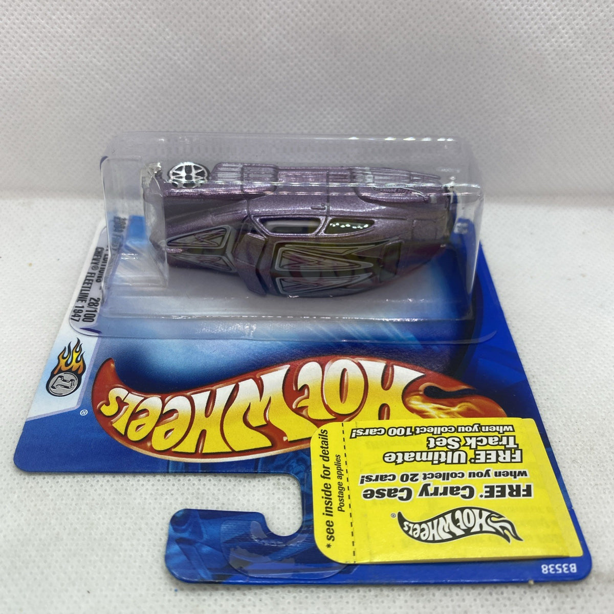 Hot Wheels diecast car blister pack showing purple car top view in clear case