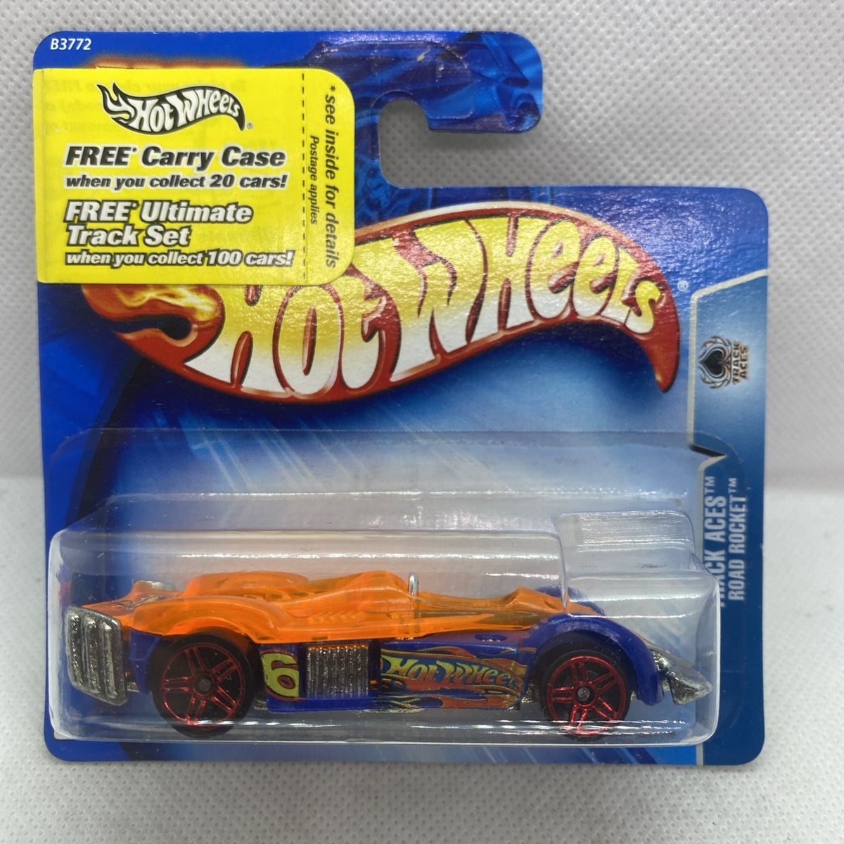 Hot Wheels Road Rocket die-cast car in clear blister, orange and blue graphics