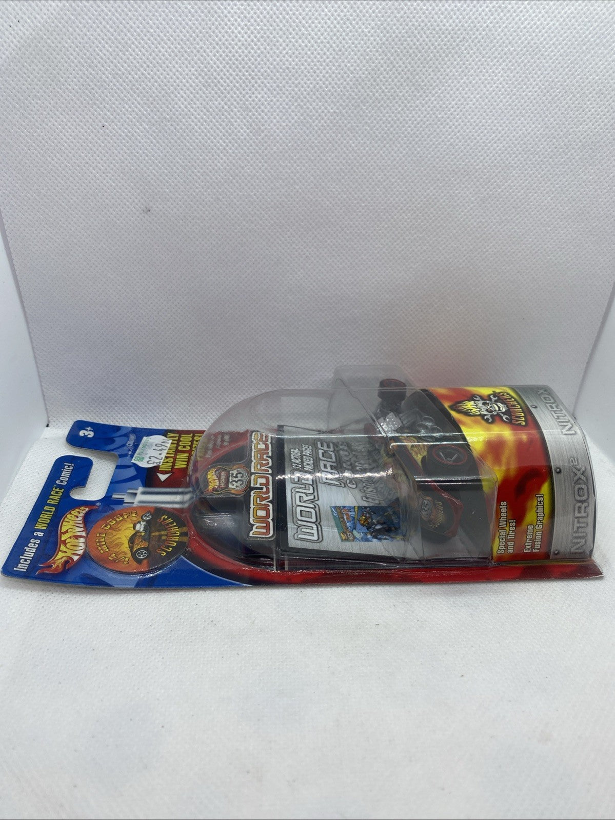 Sealed blister pack with black Scorchers race car toy and colorful World Race backing