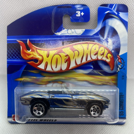 Hot Wheels die-cast Corvette on blue short card, clear blister and flame graphics