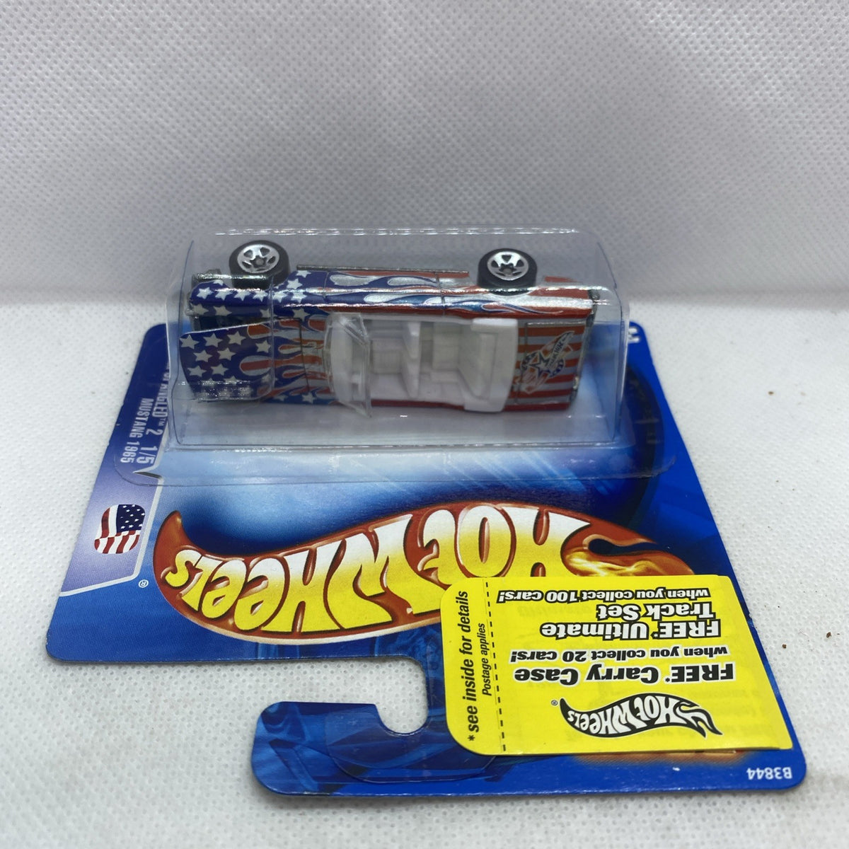 Hot Wheels die-cast Mustang toy car shown from above in clear blister