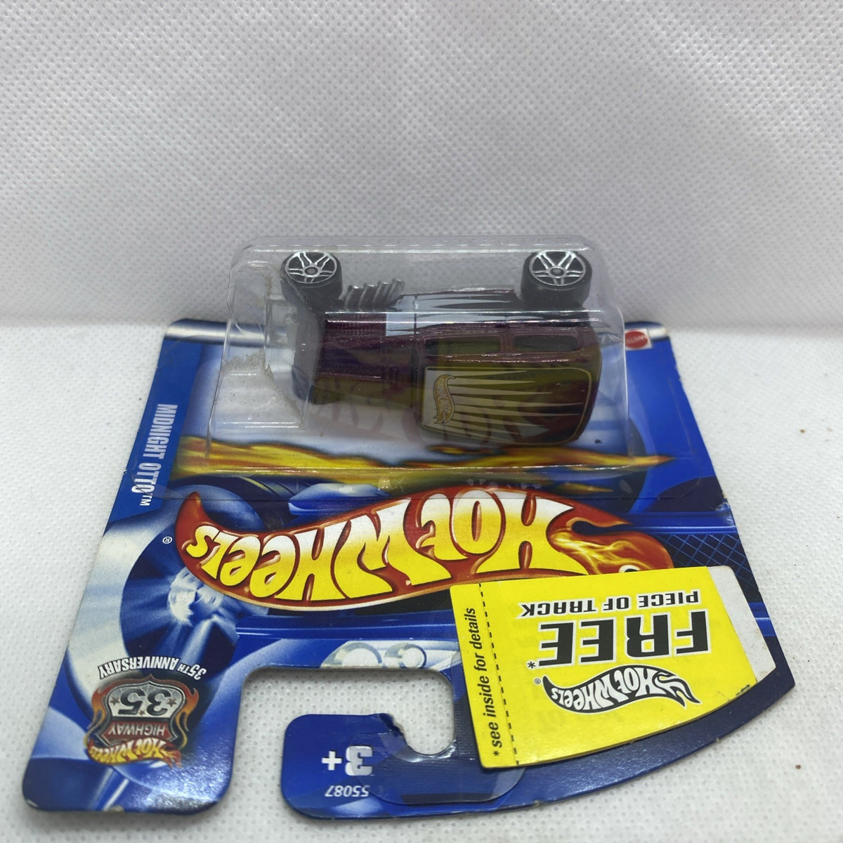 Hot Wheels Midnight Otto die-cast car blister pack on blue card, front view