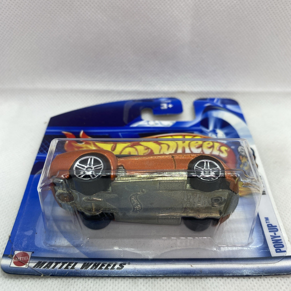 Hot Wheels Pony-Up orange coupe die-cast car in sealed blister, side view