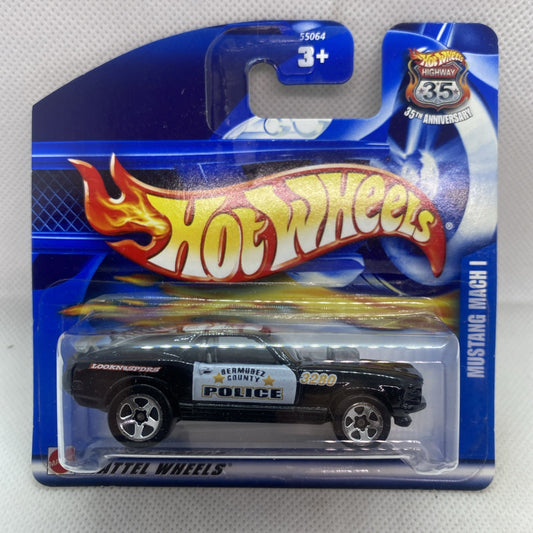 Hot Wheels die-cast police-style Mustang on blue blister card with flame Hot Wheels logo