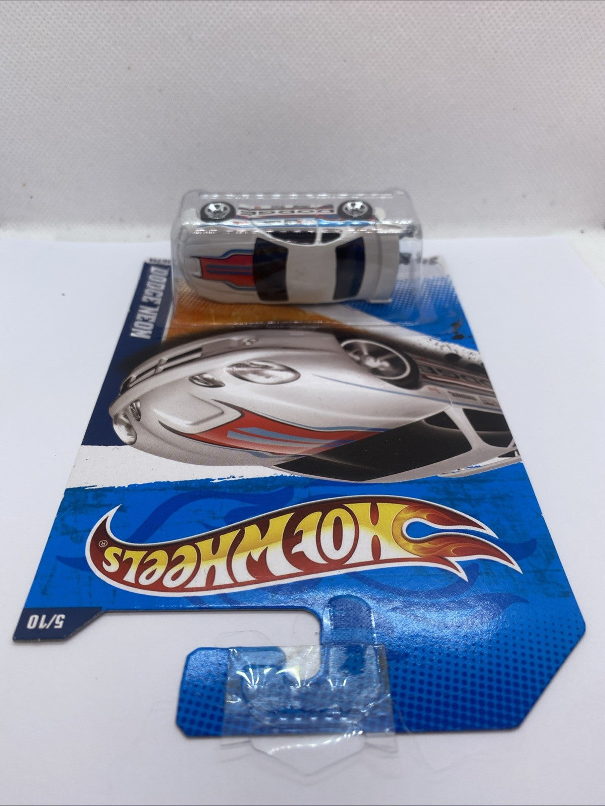 Top view of diecast dragster in clear blister on Hot Wheels card