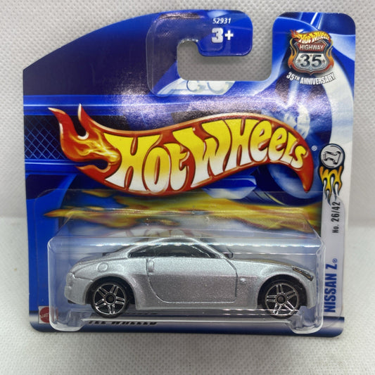 Hot Wheels die-cast Nissan Z 2002 car in blue blister card, silver-gray body