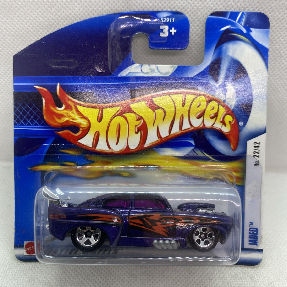 Hot Wheels die-cast car on blue card, purple-and-orange flame design