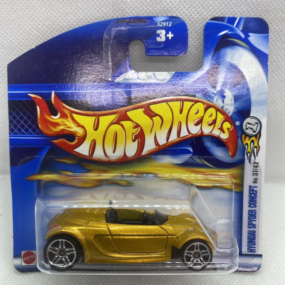Hot Wheels gold Spyder Concept die-cast car in sealed blister pack