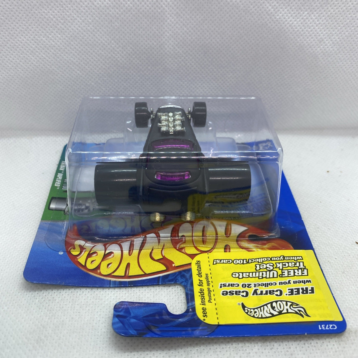 Hot Wheels die-cast car in blister pack, top view with purple window