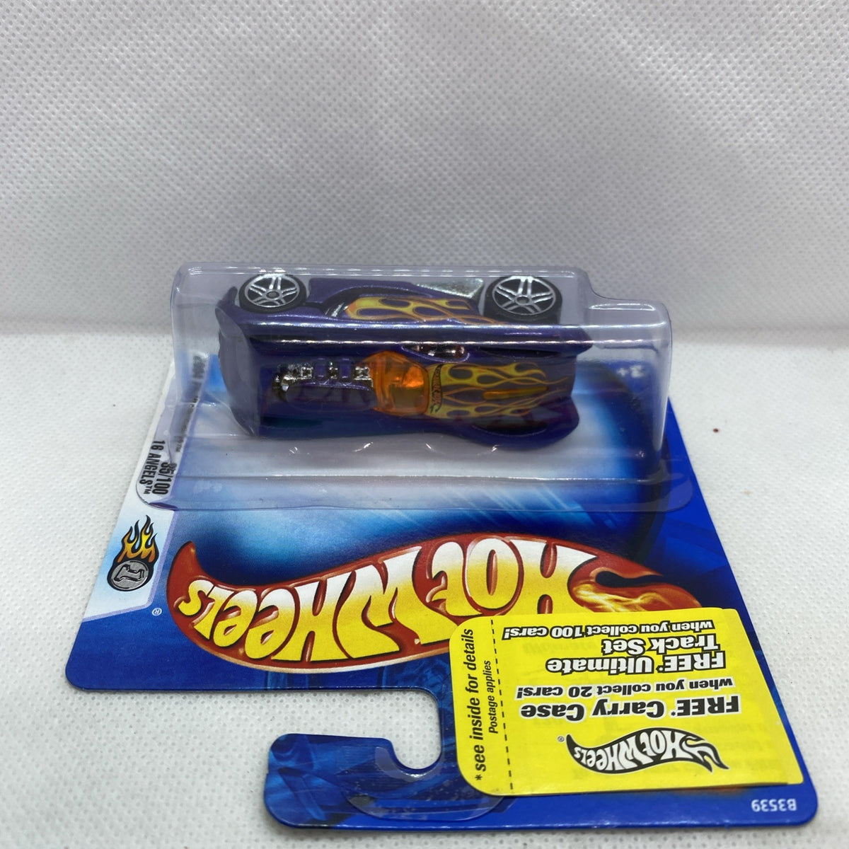 Hot Wheels purple flame die-cast car in blue blister on card