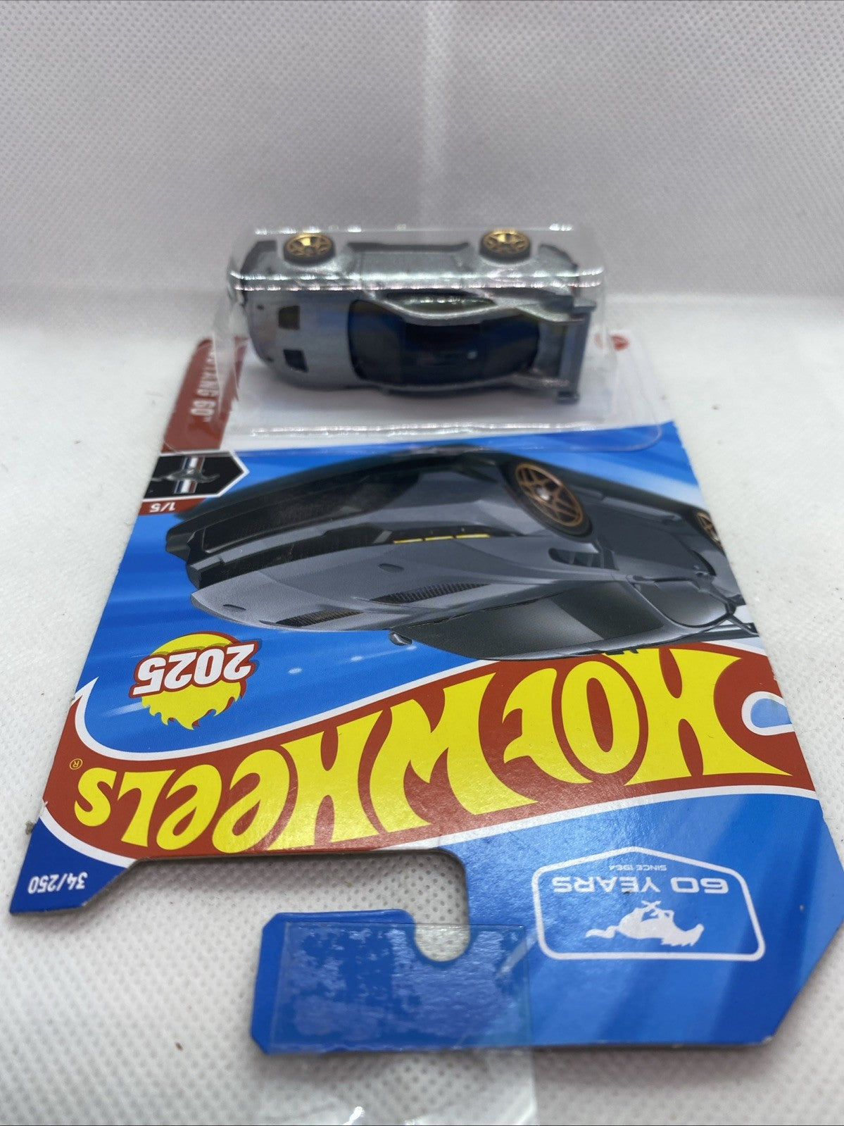 Hot Wheels Ford Mustang GTD 2025 car on card, silver-gray body visible in blister
