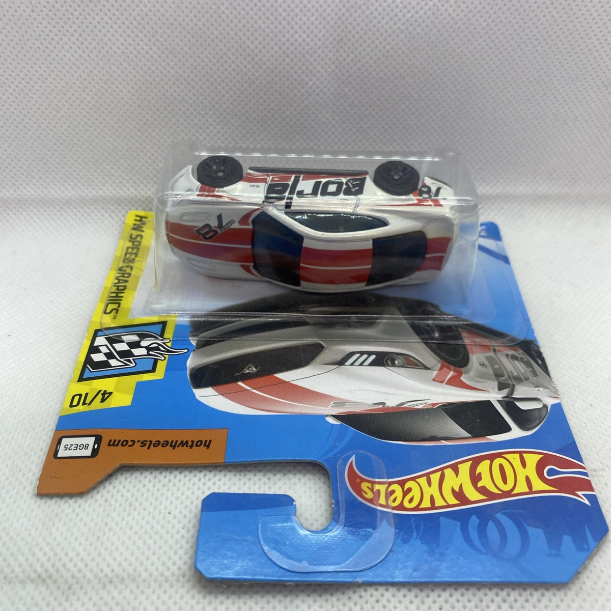 Hot Wheels Speed Graphics die-cast car blister pack, white car with red and black graphics