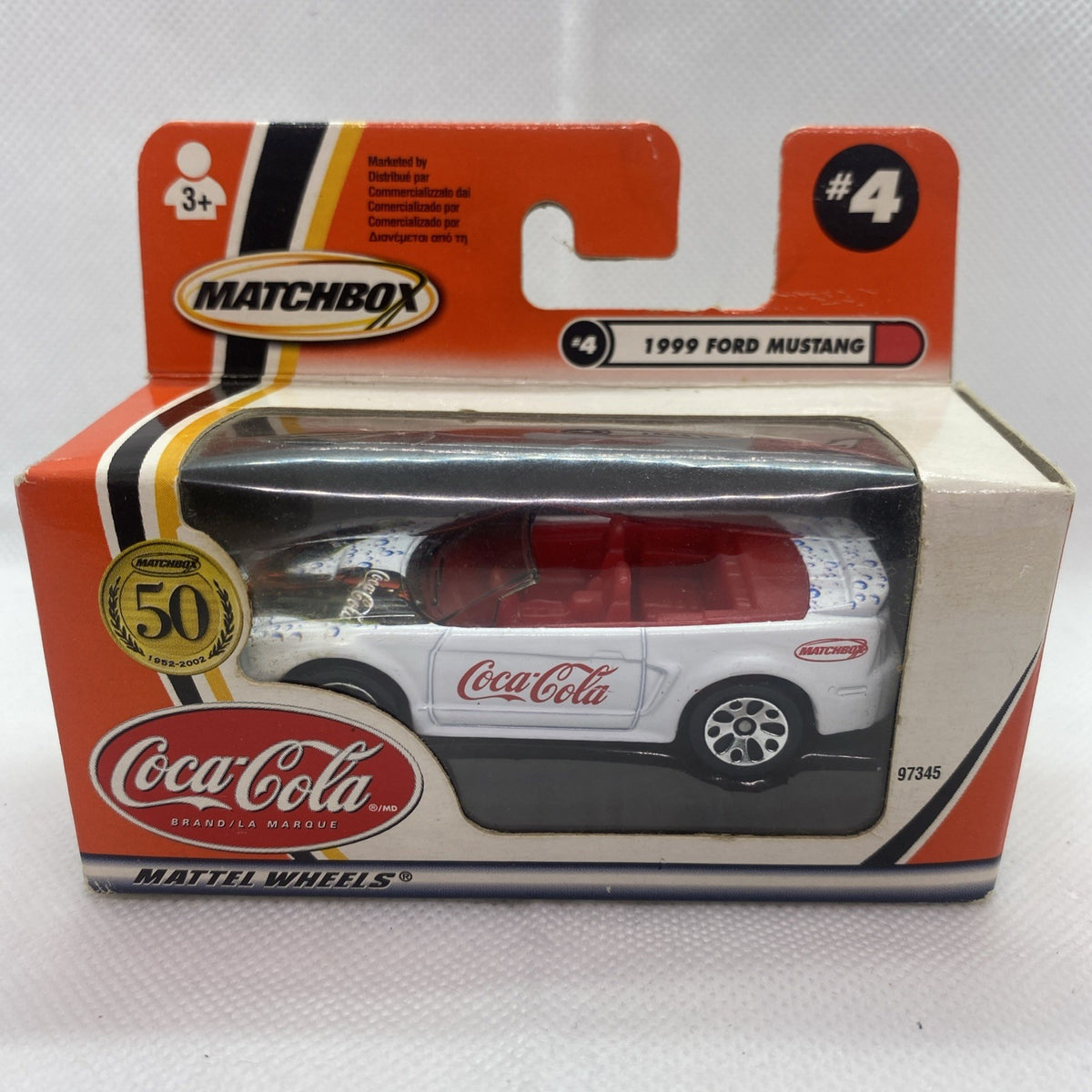 Boxed die-cast Ford Mustang #4 Coca-Cola car in clear blister with orange Matchbox box