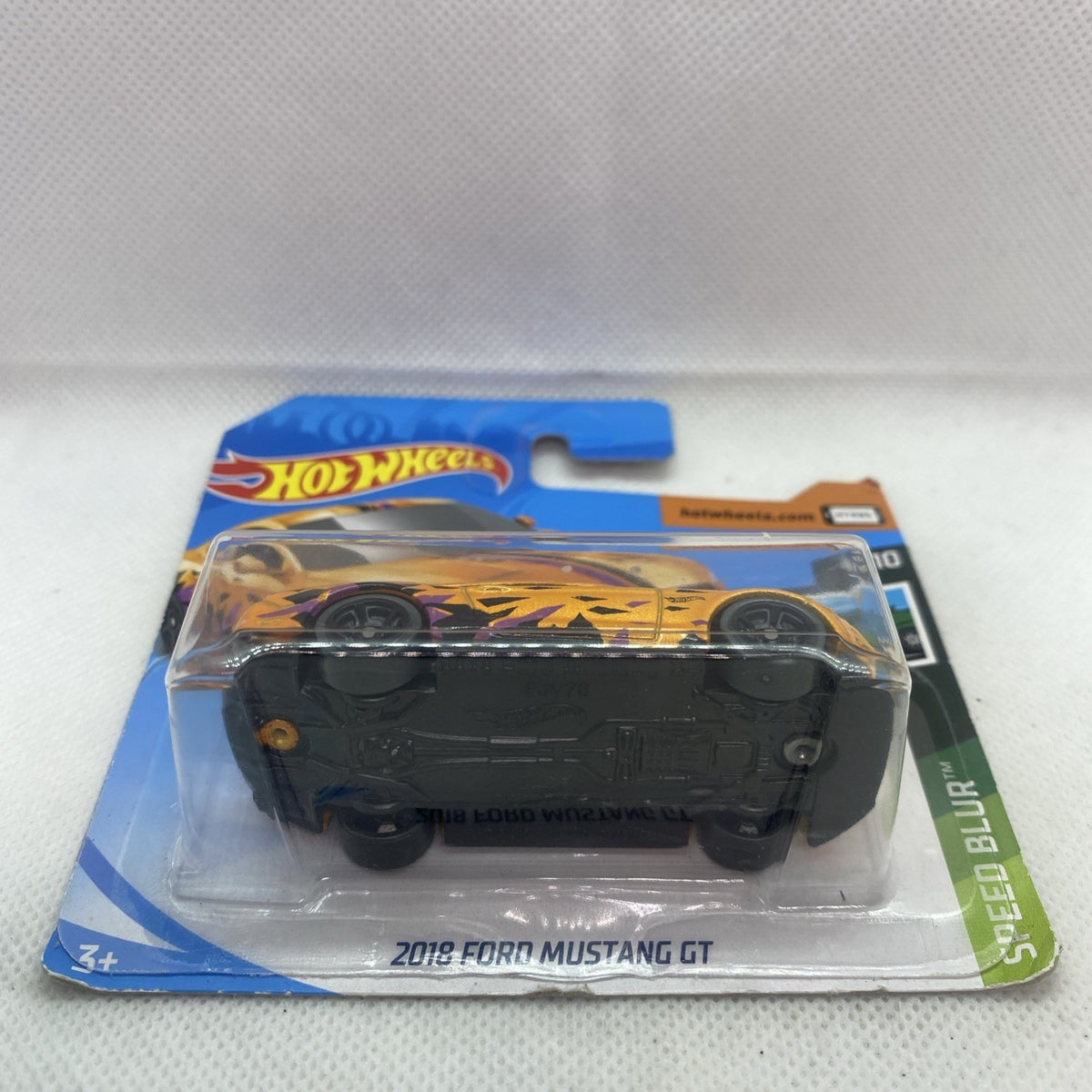 Hot Wheels Speed Blur 2019 Ford Mustang GT die-cast car on card, front view.