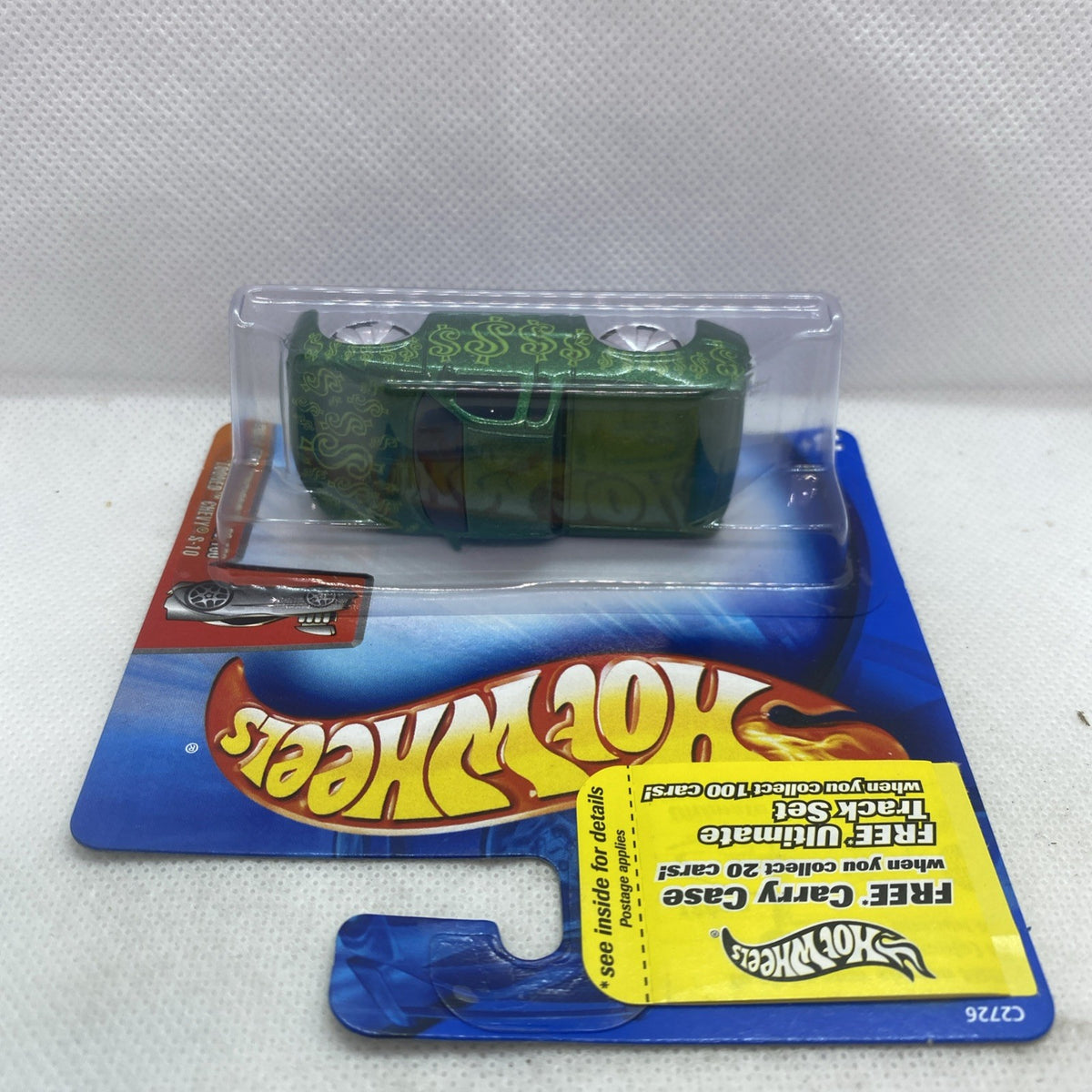 Hot Wheels green die-cast truck in clear blister on blue short card, side angle