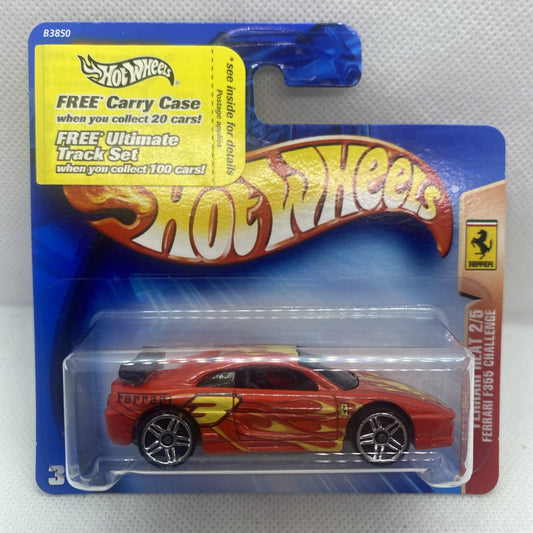 Red Hot Wheels Ferrari die-cast car in blue blister package, front view
