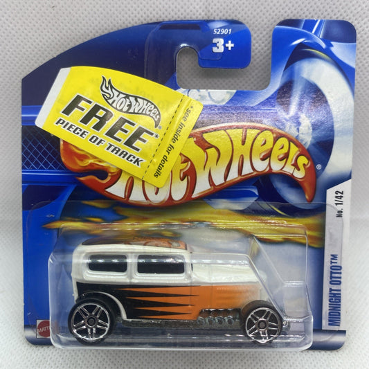 Hot Wheels Midnight Otto die-cast car in sealed blue blister pack with orange flame graphics