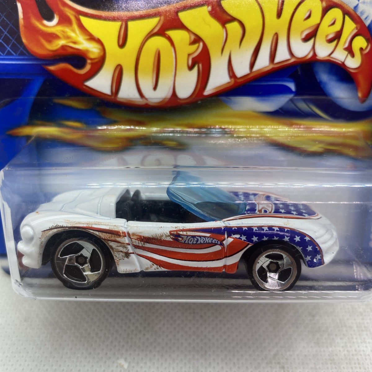 Hot Wheels Corvette die-cast close-up in clear blister, white with racing stripes