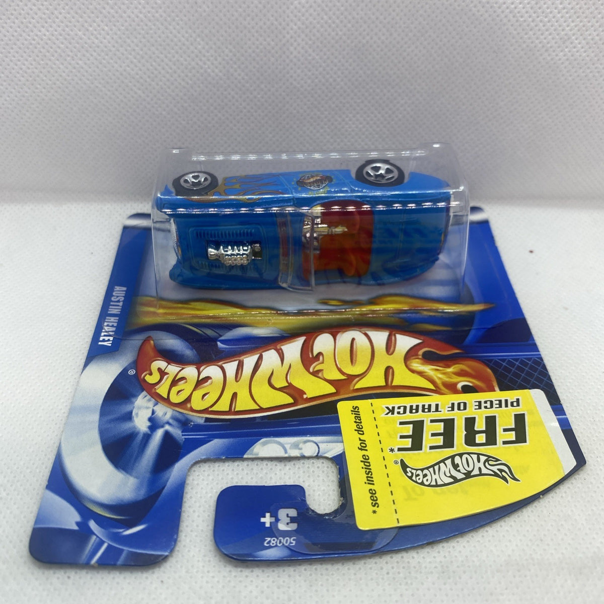 Hot Wheels die-cast car in clear blister pack, blue body with orange front stripe