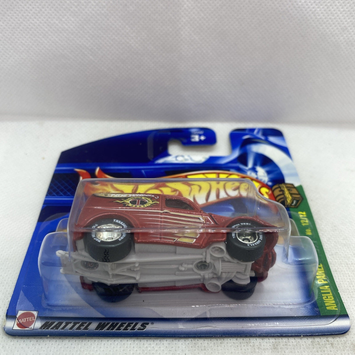 Hot Wheels 1:64 red panel van toy car in blister packaging with flame-themed graphics