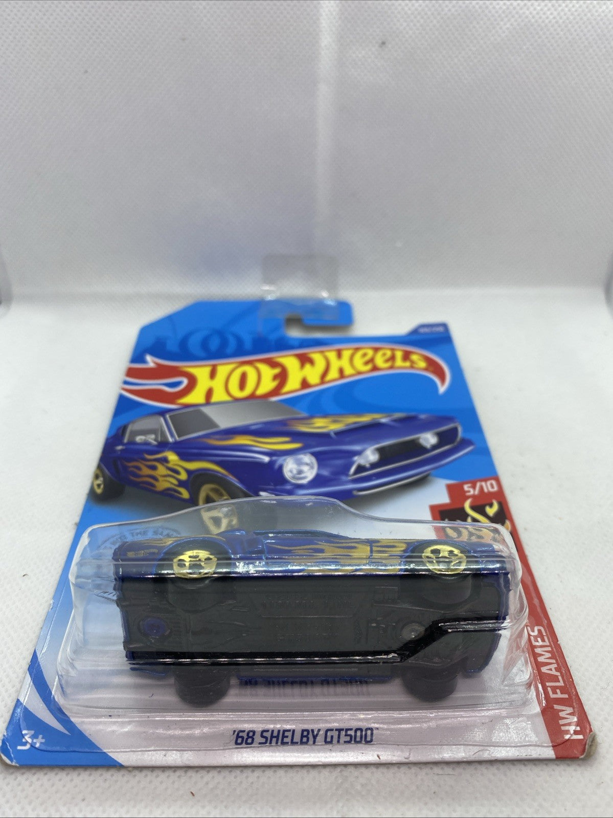 Hot Wheels '68 Shelby GT500 HW Flames die-cast car in front blister