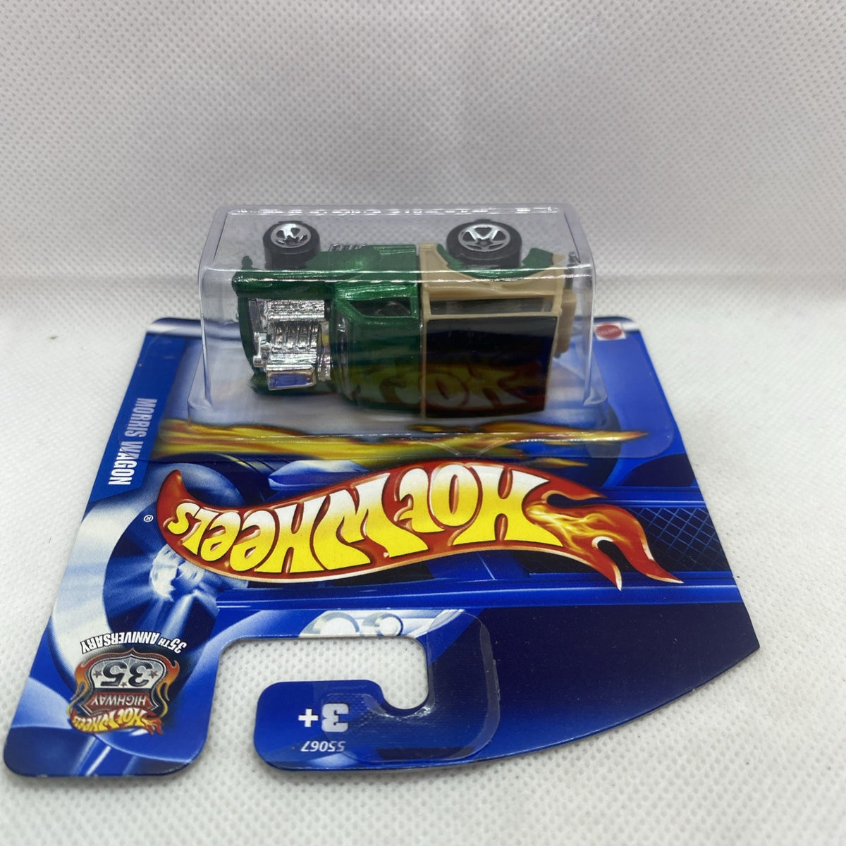 Hot Wheels Morris Wagon 2002 blister top view, green truck with tan side insert