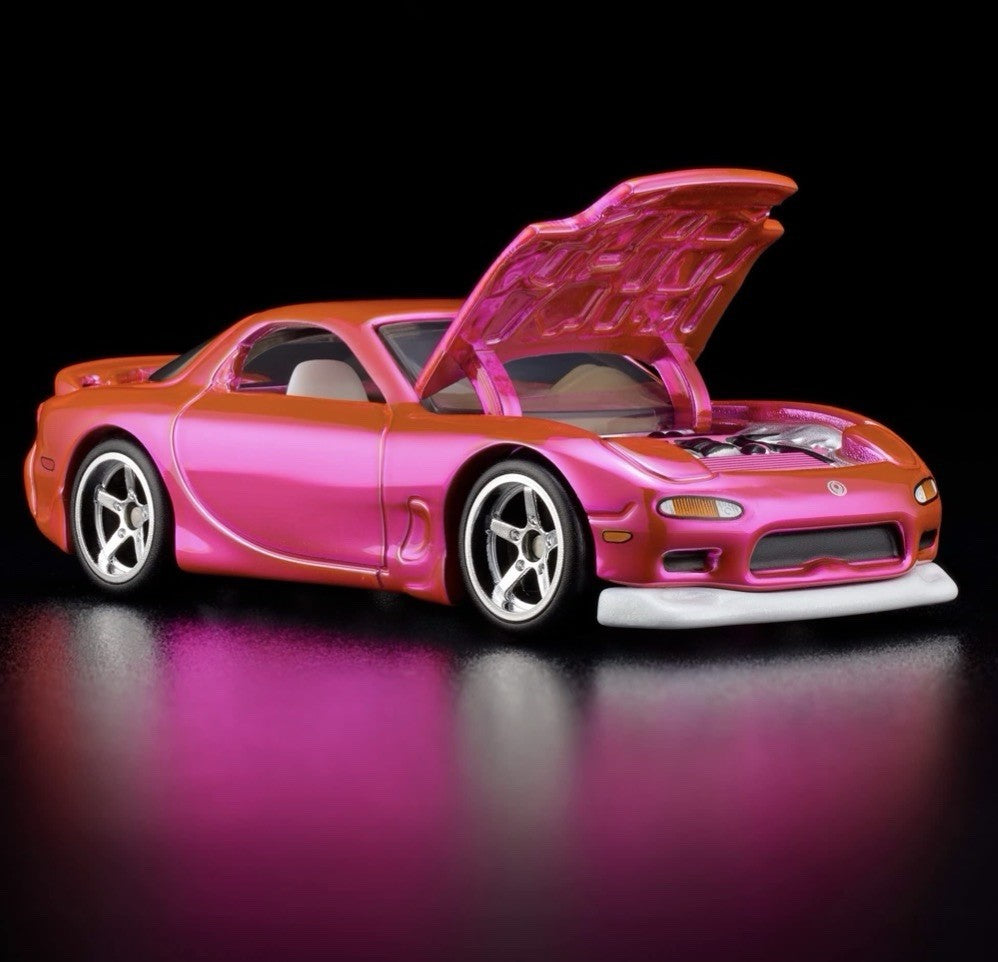 Pink and orange die-cast sports car with hood open, side 3/4 view