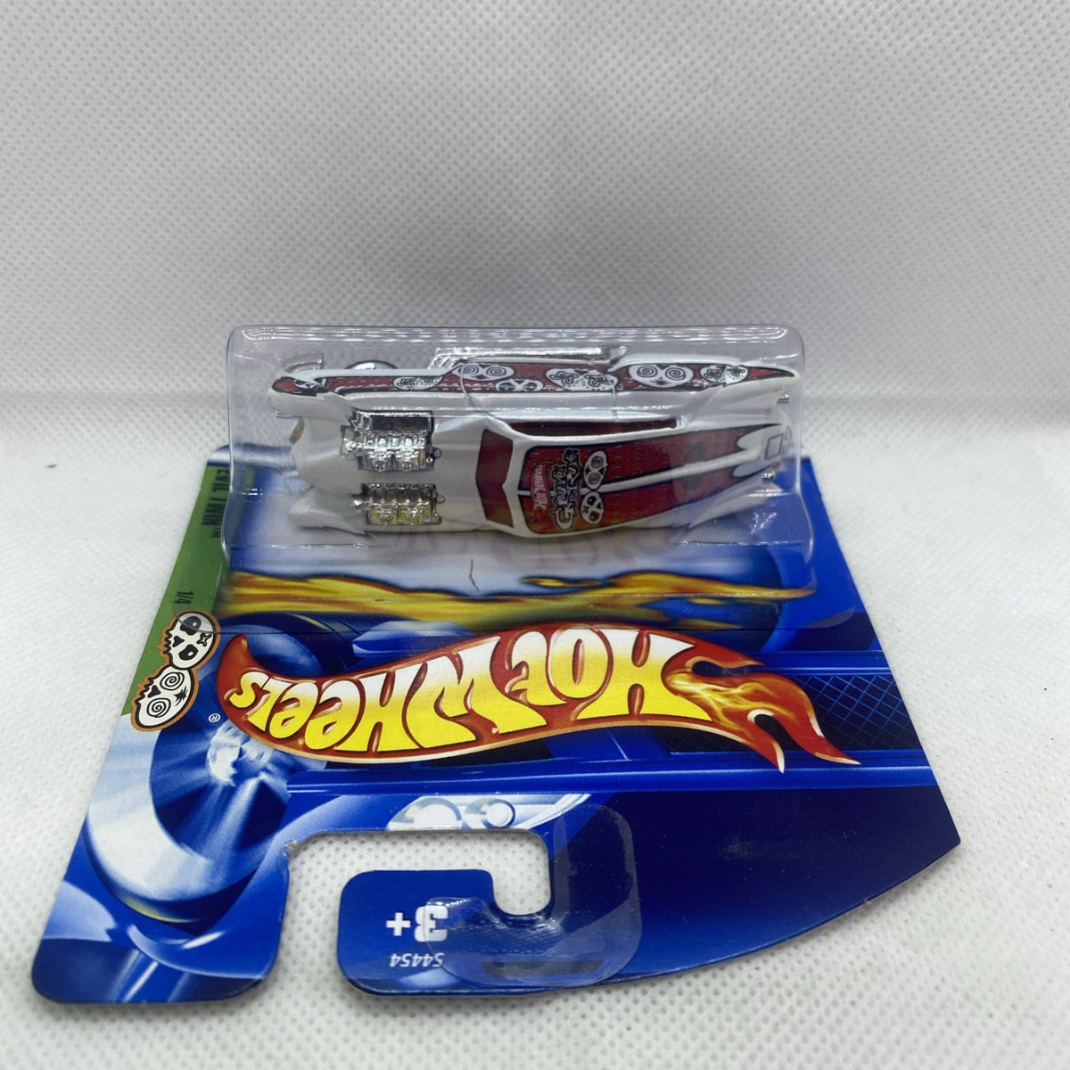 Hot Wheels die-cast car blister pack, top view with flame graphics