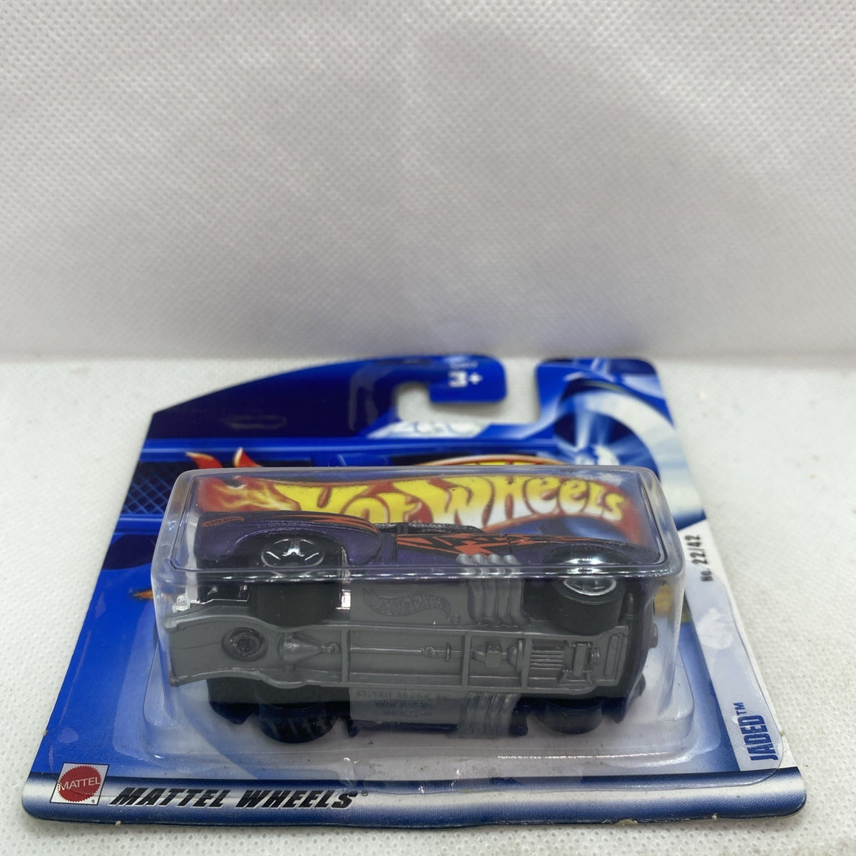 Hot Wheels die-cast car on blue card in clear blister, front view