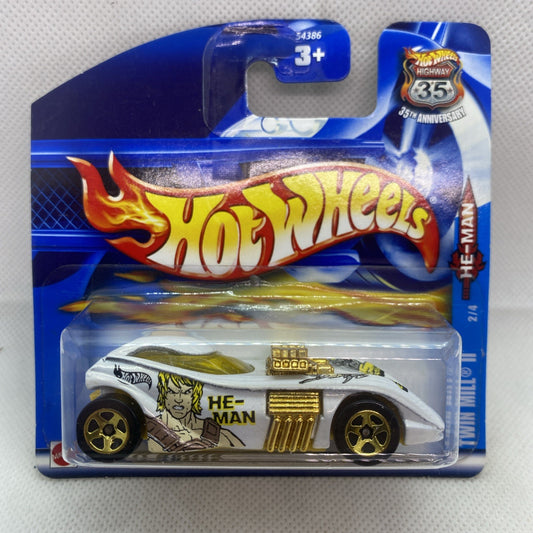 Hot Wheels die-cast car in sealed blister pack, white body with gold grille and He-Man art